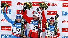 Биатлон Norway's Emil Hegle Svendsen, center, celebrates on the podium фото (photo)