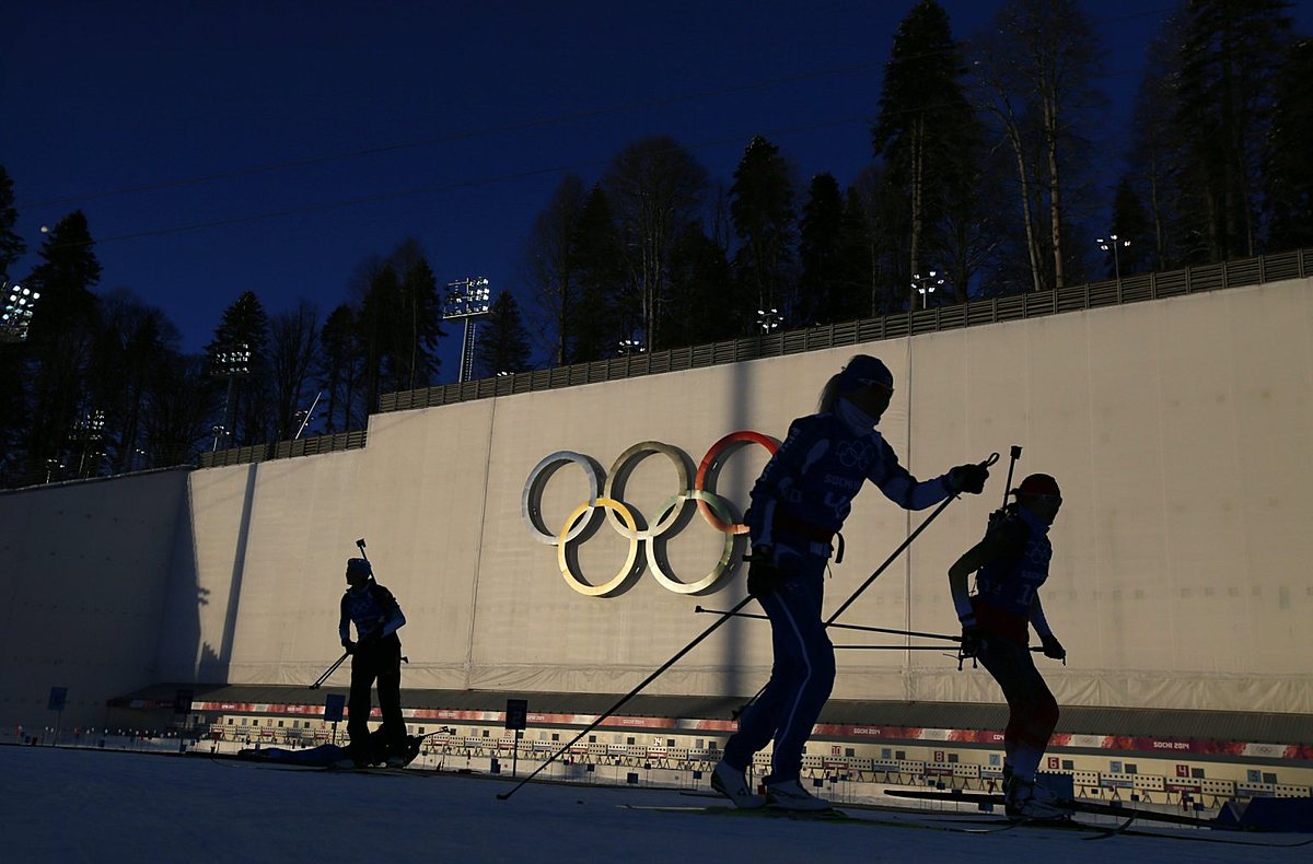 Olympic skiers take part in a biathlon training session for the фото (photo)