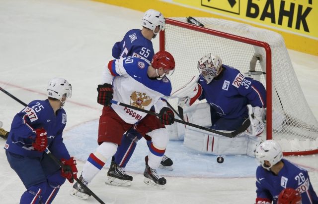 Хоккей в России: Russia's Kalinin battles for puck with фото (photo)