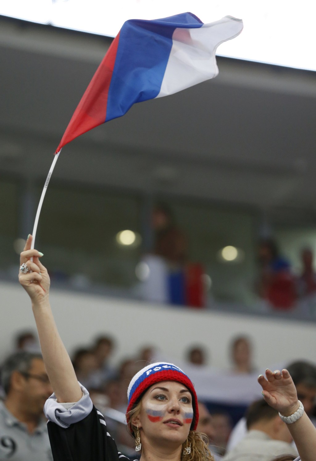Хоккей в России: A Russia's supporter celebrates her team фото (photo)