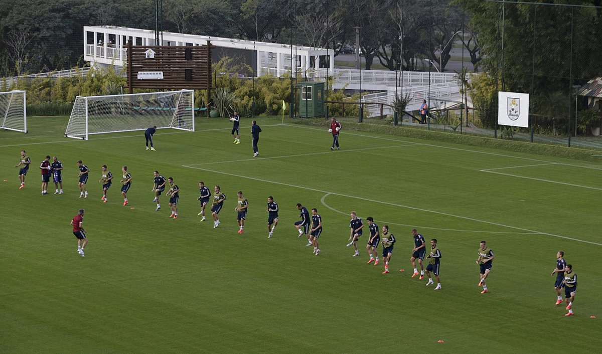 Russia's national soccer team players run during a training session near Curitiba