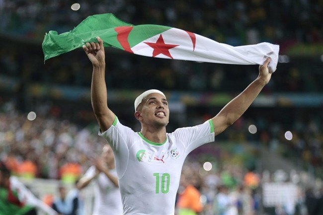 Algeria's Sofiane Feghouli celebrates after the group H фото (photo)