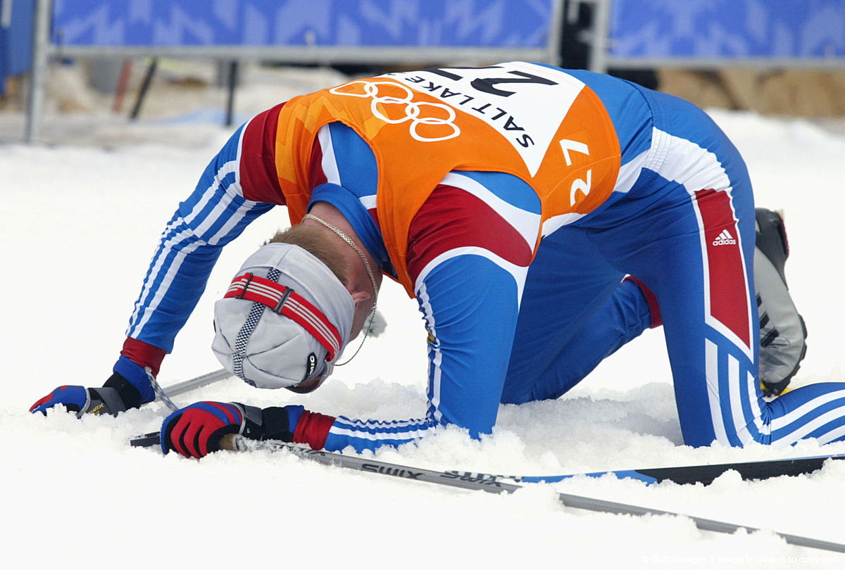 Mikhail Ivanov of Russia falls to his knees exhaus