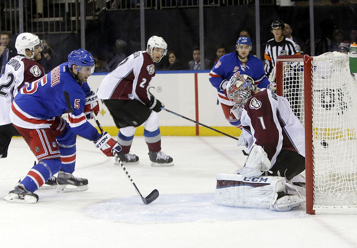 Хоккей в России: New York Rangers' Dan Girardi (5) shoots фото (photo)