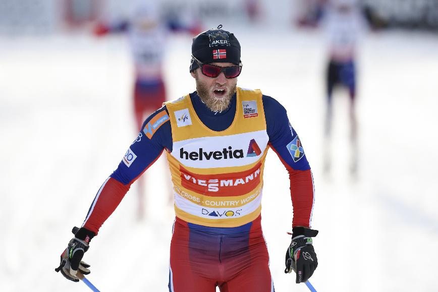 Martin Johnsrud Sundby of Norway crosses the finish line to win фото (photo)