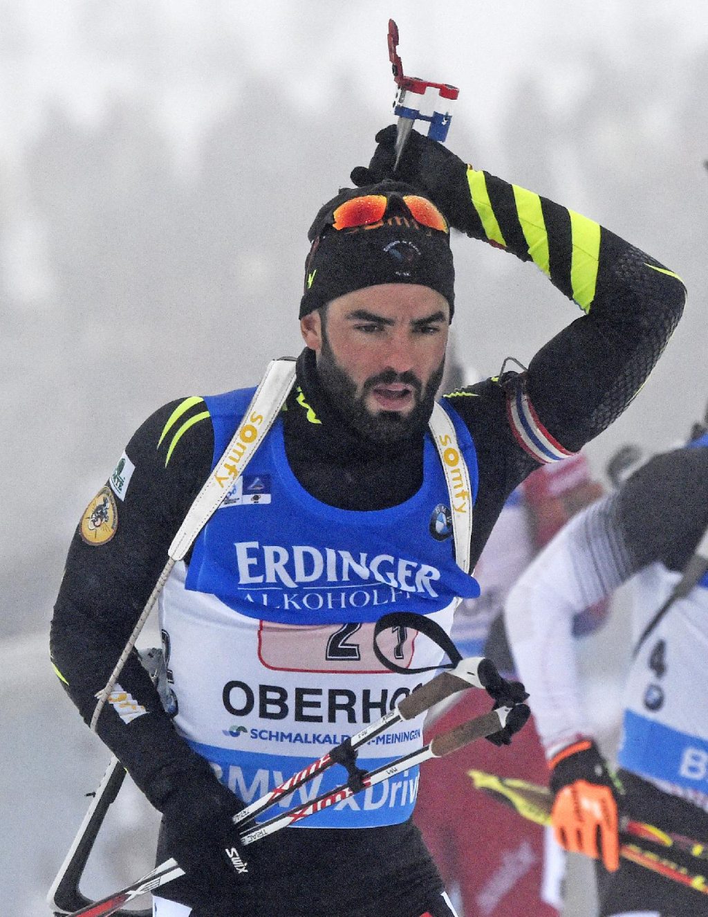 Simon Fourcade of France prepares for shooting during the men фото (photo)