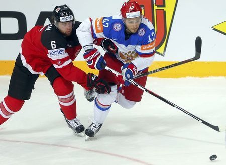 Хоккей в России: Canada's Muzzin fights for the puck with фото (photo)