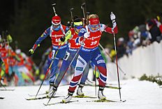 Биатлон Kaia Woeien Nicolaisen of Norway, foreground, competes during фото (photo)
