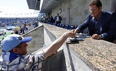 Спорт Fabio Capello (R) is greeted by a soccer fan before a Russian фото