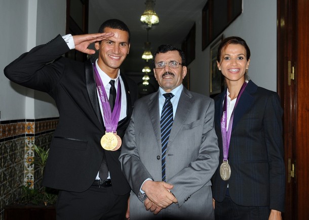 Tunisian Interior Minister Ali Larayedh (C) poses with Olympic фото