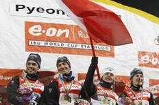 Gold medallists Simon Fourcade, Vincent Defrasne, Sylvie Becaert and Marie Laure Brunet of France (L-R) pose on the podium after the mixed relay race at the IBU Biathlon World Championships in Pyeongchang, east of Seoul February 19, 2009.