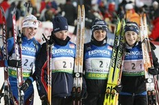 Bronze medalists Sankrine Bailly, Marie Dorin, Sylvie Becaert and Marie Laure Brunet of France (L-R) pose for photographers after the women's 4x6 km relay race at the IBU Biathlon World Championships in Pyeongchang, east of Seoul February 21, 2009.
