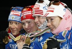 Gold medallists Olga Zaitseva, Olga Medvedtseva, Svetlana Sleptsova and Anna Boulygina (L-R) of Russia pose on the podium after the women's 4x6 km relay race at the IBU Biathlon World Championships in Pyeongchang, east of Seoul February 21, 2009.
