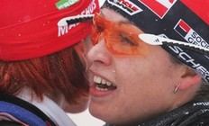POKLJUKA, SLOVENIA - DECEMBER 19: Magdalena Neuner (R) celebrates together with Kati Wilhelm of Germany after taking the third place in the Women's 7, 5km Sprint in the e.on Ruhrgas IBU Biathlon World Cup on December 19, 2009 in Pokljuka, Slovenia.