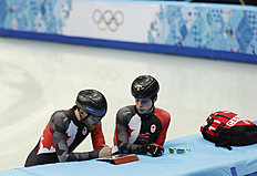 Конькобежный спорт Canada's Jean Olivier, left, and Charle Cournoyer look at фото (photo)