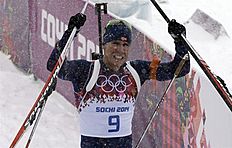 Norway's Emil Hegle Svendsen celebrates after winning the gold in the men's biathlon 15k mass-start, at the 2014 Winter Olympics, Tuesday, Feb. 18, 2014,...