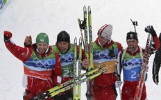 Austria's Simon Eder, Daniel Mesotitsch, Dominik Landertinger and Christoph Sumann (L-R) celebrate their second place at the men's 4 x 7.5 km relay biathlon final at the Vancouver 2010 Winter Olympics in Whistler, British Columbia, February 26, 2010.