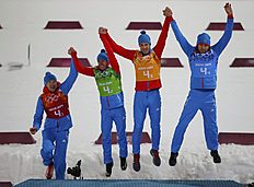 Биатлон Russia's relay team celebrate during flower ceremony for фото (photo)