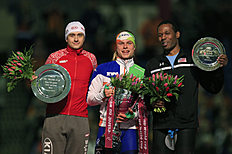 Конькобежный спорт Koen Verweij of the Netherlands, center, hold the World Cup trophy фото (photo)