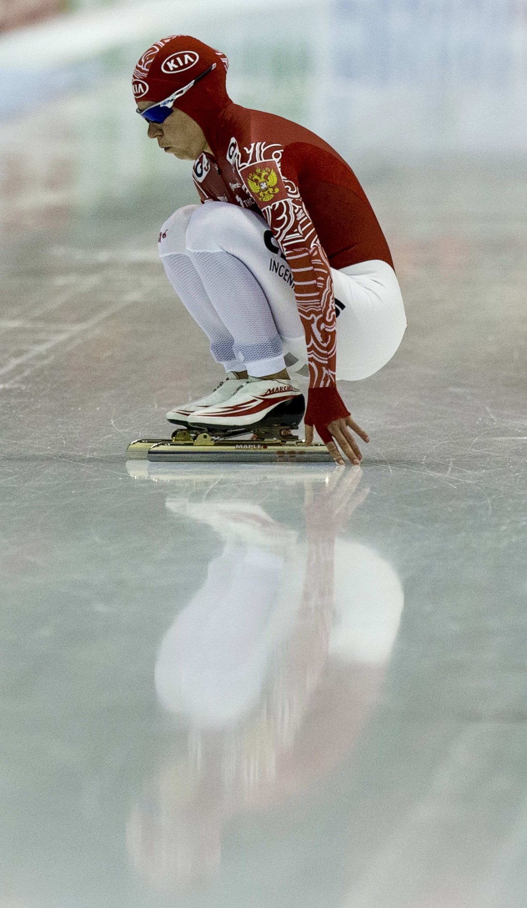 Graf of Russia warms up before the women's 5000 metres event фото (photo)