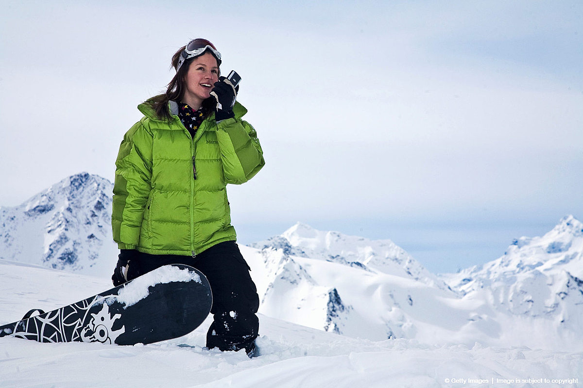 Snowboard (сноуборд): Young woman talking on a walkie-talkie фото (photo)