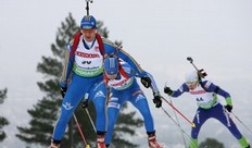 OSLO, NORWAY - MARCH 18: Anna Carin Olofsson-Zidek of Sweden competes with Svetlana Sleptsova of Russia and Dijana Ravnikar of Slovenia during the women's sprint in the E.On Ruhrgas IBU Biathlon World Cup on March 18, 2010 in Oslo, Norway.