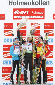 Germany's first placed Simone Hauswald (C) stands on the podium with third placed compatriot Magdalena Neuner (R) and second placed Vita Semerenko of Ukraine after the women's 12, 5 km mass start biathlon World Cup race in Holmenkollen Ski Arena in Oslo, March 21, 2010.