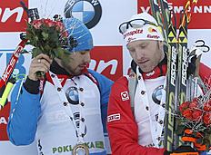 Pokljuka (Slovenia), 21/12/2014.- Winner Anton Shipulin (L) of Russia and third placed Simon Eder of Austria celebrate on the podium of the Men's...