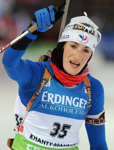 France's Marie-Laure Brunet celebrates as she crosses the finish line in second place during the women's 7, 5 km sprint event of the Biathlon World Cup in the Siberian city of Khanty-Mansiysk on March 25, 2010.
