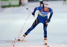 Marie-Laure Brunet of France crosses the finish line in second place during the women's 7, 5 km sprint event of the Biathlon World Cup in the Siberian city of Khanty-Mansiysk on March 25, 2010.