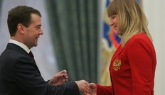 MOSCOW, RUSSIA - APRIL 2: Russian President Dmitry Medvedev greets 2010 Paralympics Winter Games bronze winner in biathlon Alyona Gorbunova (R) while awarding her with an Order of Merit For the Fatherland during an awarding ceremony of Russian Paralympics athletes at the Kremlin on April 2, 2010 in Moscow, Russia. Russia won 38 medals at the 2010 Paralympics Winter Games, including 12 golds, 16 silvers and 10 bronzes.
