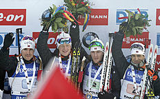 Norway's Emil Hegle Svendsen, from left, Johannes Thingnes Boe, Erlend Bjoentegaard and Ole Einar Bjoerndalen wave on the podium after winning the men's...