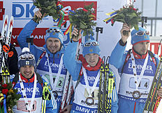 Russia's Evgeniy Garanichev, from left, Timofey Lapshin, Dmitry Malyshko and Anton Shipulin wave on the podium after the men's 4x7.5 km relay at the Biathlon...
