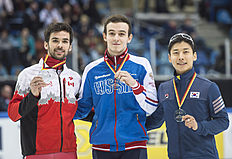 Конькобежный спорт Winner Dmitry Migunov of Russia, center, celebrates beside second фото (photo)