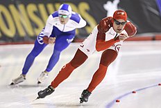 Конькобежный спорт Denny Morrison, of Canada, right, is lapped by Denis Yuskov of фото (photo)