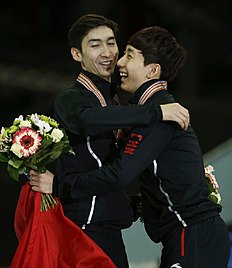Конькобежный спорт China's Wu Dajing and Han Tianyu celebrate during victory фото (photo)