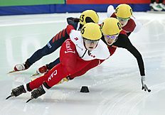 Конькобежный спорт Boutin of Canada is followed by Fan Kexin of China during women фото (photo)
