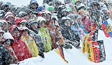 Spectators attend the ladies 12,5 kilometer mass start competition at the Biathlon World Cup during heavy snow fall on January 16, 2016 in Ruhpolding, southern Germany.nCzech Gabriela Soukalova won the competition, German Franziska Hildebrand placed second and German Laura Dahlmeier placed third. / AFP / Christof STACHE