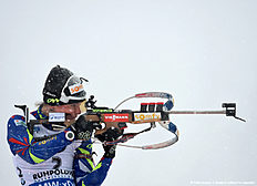 French Marie Dorin Habert competes during the warm up shooting ahead the ladies 12,5 kilometer mass start competition at the Biathlon World Cup during heavy snow fall on January 16, 2016 in Ruhpolding, southern Germany.nCzech Gabriela Soukalova won the competition, German Franziska Hildebrand placed second and German Laura Dahlmeier placed third. / AFP / Christof STACHE
