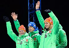 (L-R) Germany's Franziska Hildebrand, Simon Schempp, Franziska Preuss and Arnd Peiffer celebrate with their Silver Medals at the medals ceremony after the 2x6 + 2x7,5 mixed relay event at the IBU World Championships Biathlon competition in Holmenkollen Arena in Oslo, Norway on March 3, 2016. nThe French team won the event ahead of Germany and Norway. / AFP / JONATHAN NACKSTRAND