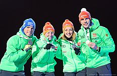 (L-R) Germany's Simon Schempp, Franziska Hildebrand, Franziska Preuss and Arnd Peiffer celebrate with their Silver Medals at the medals ceremony after the 2x6 + 2x7,5 mixed relay event at the IBU World Championships Biathlon competition in Holmenkollen Arena in Oslo, Norway on March 3, 2016. nThe French team won the event ahead of Germany and Norway. / AFP / JONATHAN NACKSTRAND