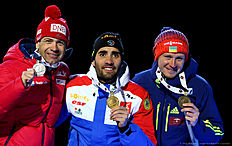 OSLO, NORWAY — MARCH 05: (L-R) Ole Einar Bjoerndalen (silver) of Norway, Martin Fourcade of France (gold) and Sergey Semenov (bronze) of Ukraine celebrate their medal in the men's 10km sprint during day three of the IBU Biathlon World Championships at Medal Plaza on March 5, 2016 in Oslo, Norway.