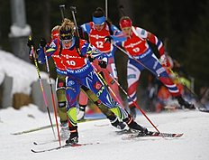 Second placed Marie Dorin Habert of France, foreground, competes during the women's 10 km pursuit at the IBU World Championships Biathlon at Khanty-Mansiysk, 2759 km north-east of Moscow, Russia, Saturday, March 19, 2016. (AP Photo/Sergei Grits)