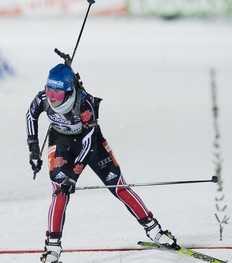 Miriam Gossner of Germany reacts as she crosses the finish line in 2nd place during the women's Biathlon 7.5 km sprint race at the World Cup event on December 3, 2010 in Oestersund, Sweden.