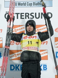 Emil Hegle Svendsen of Norway celebrates on the podium after winning the men's Biathlon 10 km sprint race on December 4, 2010 in Oestersund.