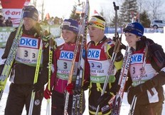 France's Vincent Jay (L), Sophie Boilley, (2nd L), Alexis Boeuf (2nd R) and Marie Laure Brunet celebrate their second place finish during the IBU World Cup Biathlon Mixed Relay February 5, 2011 in Presque Isle, Maine. Germany finished first with France in second and Russia in third.