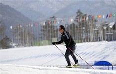 A man skies at the biathlon venue for Pyeongchang 2018 Winter Olympic in Pyeongchang, east of Seoul, South Korea, Saturday, Feb. 19, 2011. Pyeongchang is bidding again to host the Winter Games after narrow defeats to Vancouver for 2010 and Sochi, Russia, for 2014.