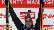Winner Arnd Peiffer of Germany celebrates on the podium after the men 10 km sprint at the IBU World Championships Biathlon at Khanty-Mansiysk, 2759 km north-east of Moscow, Russia, Saturday, March 5, 2011.