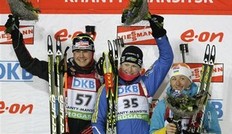 Winner Helena Ekholm of Sweden, center, second placed Tina Bachmann of Germany, left, third placed Vita Semerenko of Ukraine, right, seen on the podium after the women's 15 km individual at the IBU World Championships Biathlon at Khanty-Mansiysk, 2759 km North-East of Moscow, Russia, Wednesday, March 9, 2011.