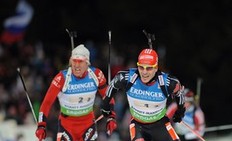 Emil Helge Svendsen of Norway (L) and Arnd Peiffer of Germany compete during the Men's 4 x 7.5 km relay event of the Biathlon World Championships in the Siberian city of Khanty-Mansiysk on March 11, 2011. Norway won ahead of Russia and Ukraine.